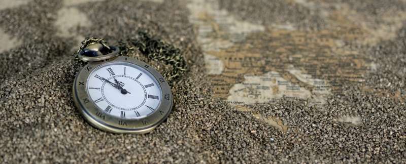 Pocket Watch lying on a granite surface, photo credit Pixabay