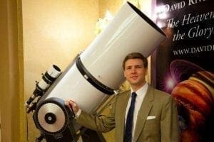 David Rives with large white telescope