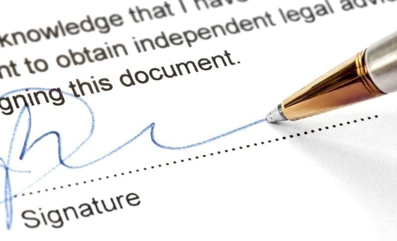 Signing a legal document, photo credit: ID 49192978 © Robyn Mackenzie | Dreamstime.com