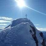 Snowy mountain summit with cross, photo credit: Max Pixel