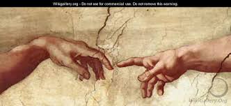 close up of Michelangelo's creation of man painting (hands touching)