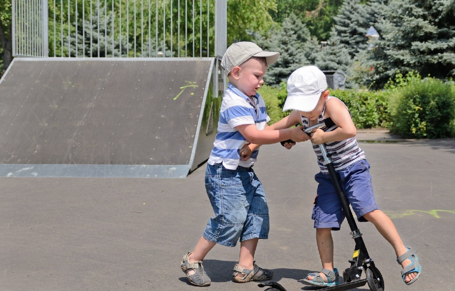 Two boys fighting over a scooter: ID 32261797 © Ampack | Dreamstime.com