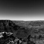 Black and white panorama of the Grand Canyon emphasizing the flat horizon above