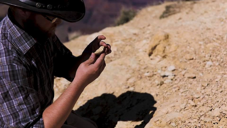 Man holding rock, photo credit: Canyon Ministries