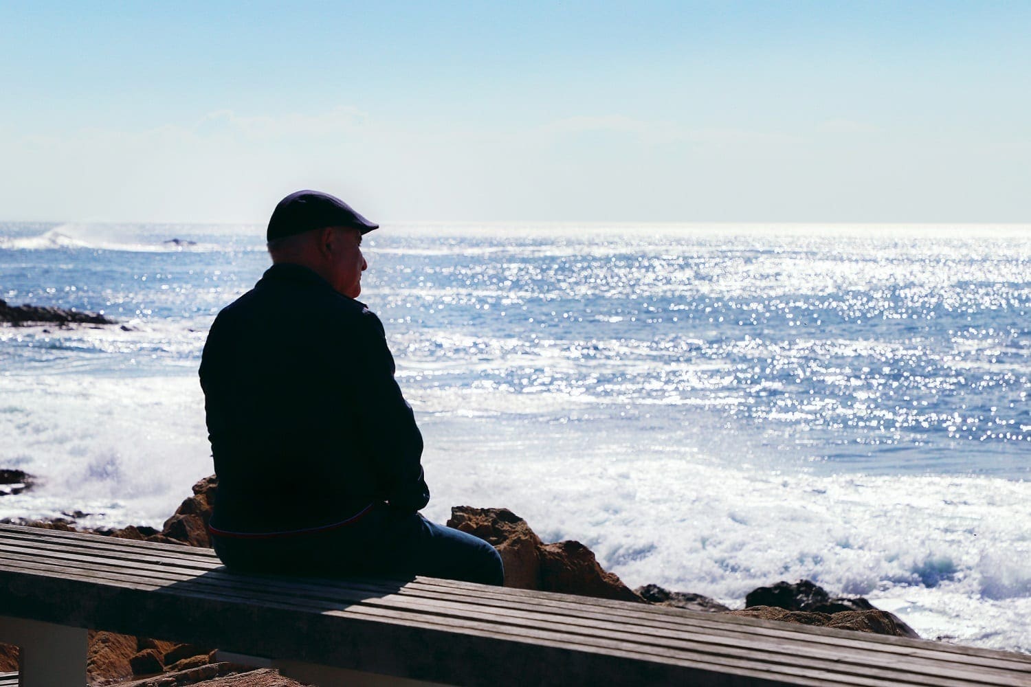 Old man sitting on a bench watching the ocean: ID 132930490 © Olena Klymenok | Dreamstime.com