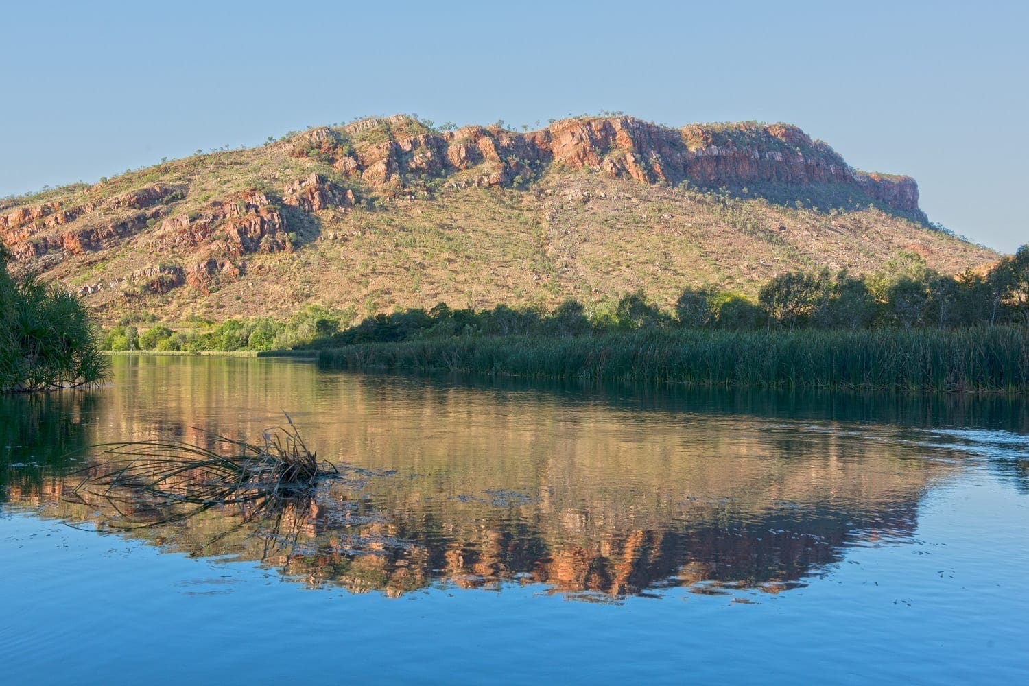 View of a sandstone hill from the Ord river near Kununurra, Western Australia.ID 108417732 © Johncarnemolla | Dreamstime.com